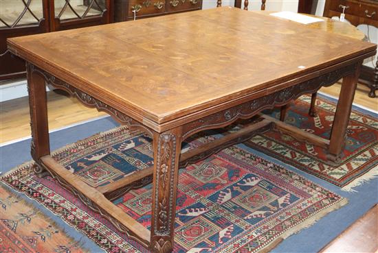 A French oak draw leaf dining table L.160cm unextended